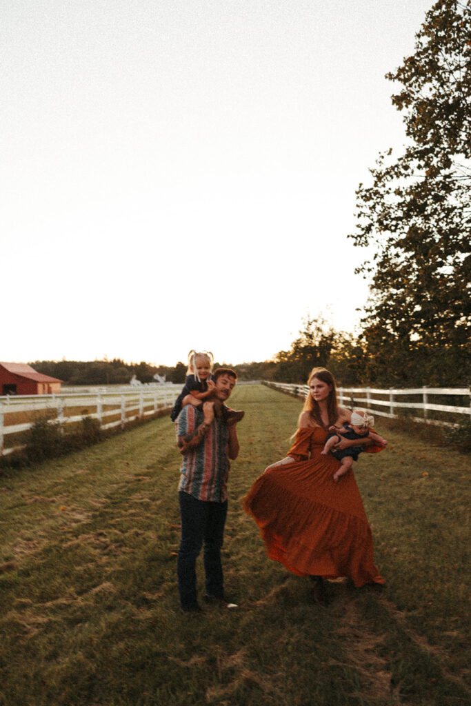 Natural family moment captured outdoors on a farm during a fall family photography session in Door County.