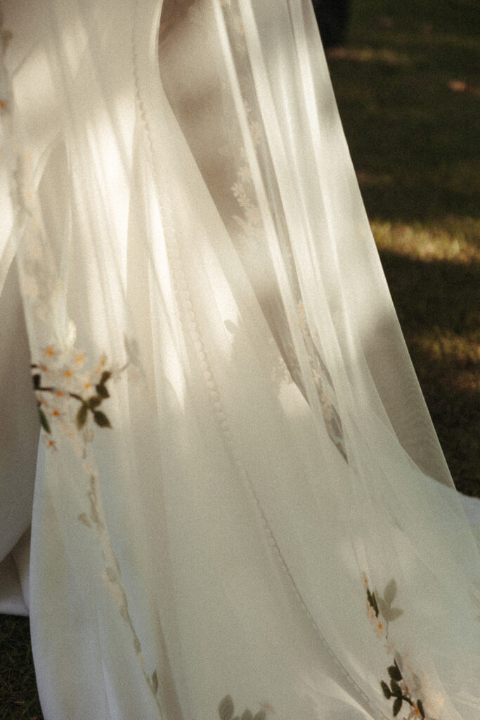 Details of the bride's wedding dress and veil during her Door County wedding day