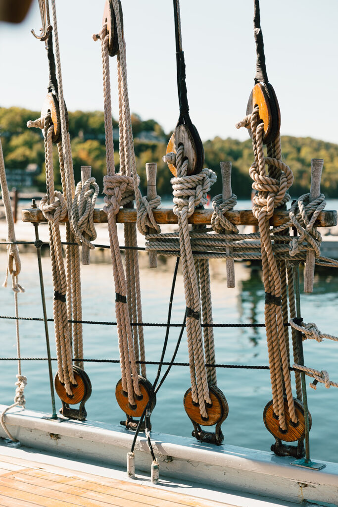 Sailboat rigging and pulleys photographed during a Door County wedding on the water