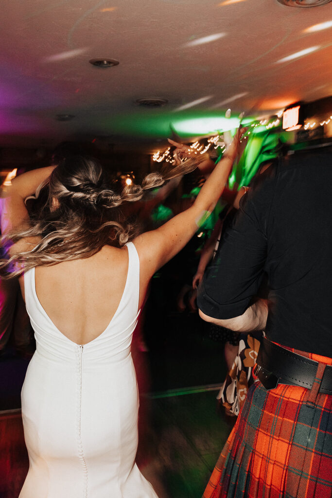 Guests dancing and celebrating during a lively Door County wedding reception 