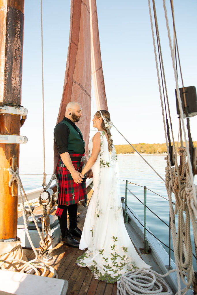 Bride and groom sharing a quiet moment on a sailboat in Door County 