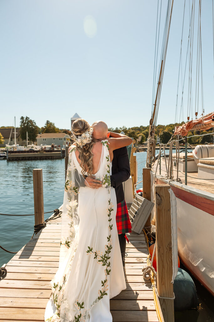 Bride and groom are hugging after they see each other for the first time
