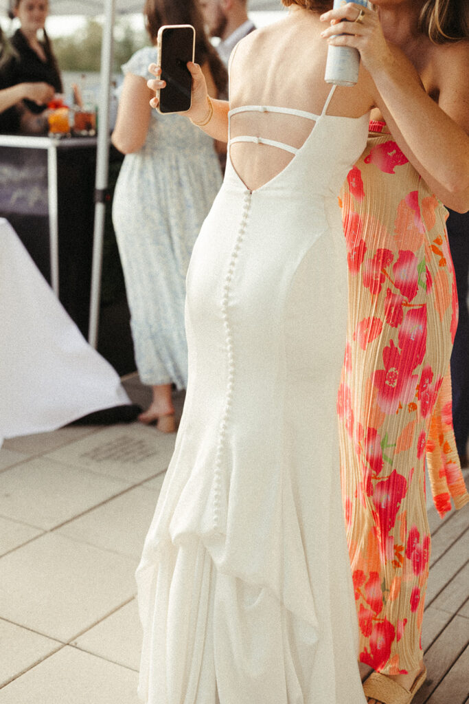 Bride hugging a guest during a relaxed cocktail hour in Door County