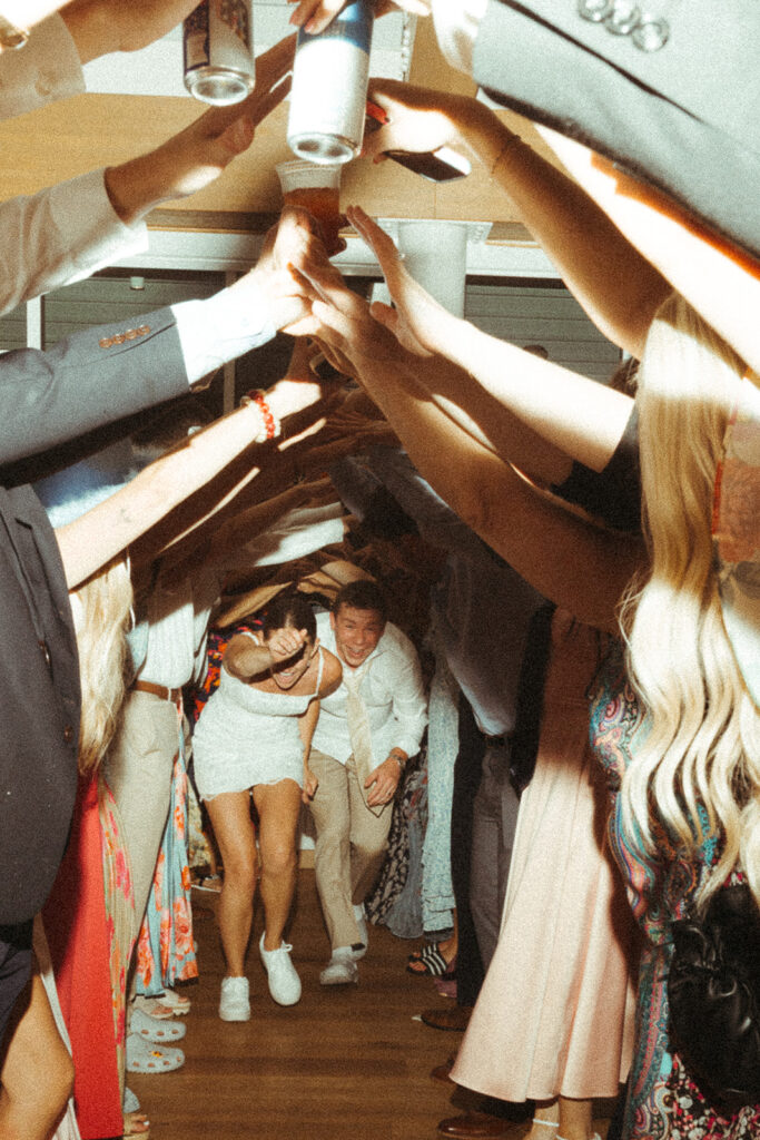Bride and groom dancing with guests during a fun Door County wedding reception