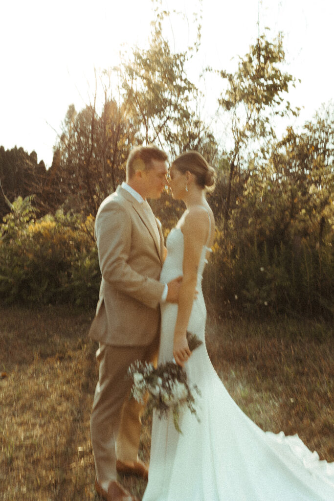 Bride and groom sharing a quiet moment during a golden hour on their Door County wedding day