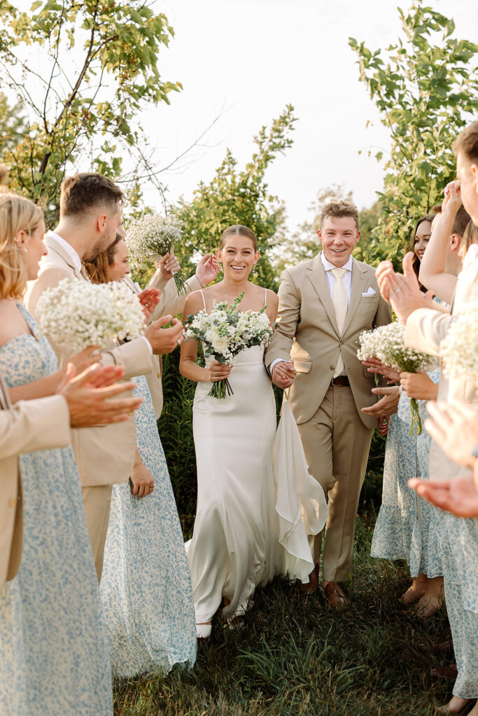 Bridal party cheering during a Door County wedding celebration