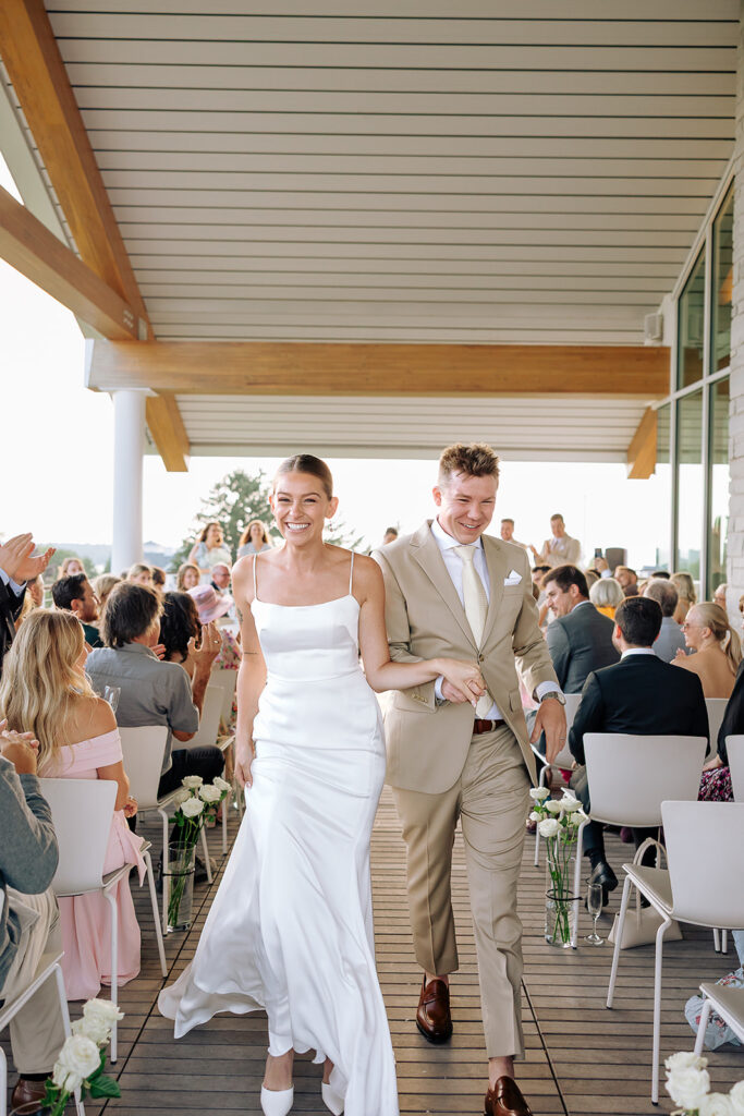 Bride and Groom walking back down aisle during their Door County wedding ceremony
