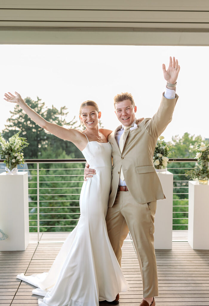 Bride and groom celebrate after their wedding ceremony at Kress Pavilion