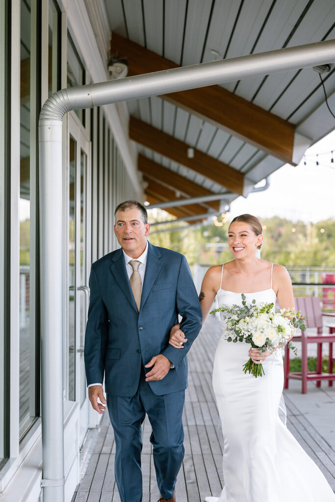 Bride and her father walking down the aisle during a Coor County wedidng ceremony