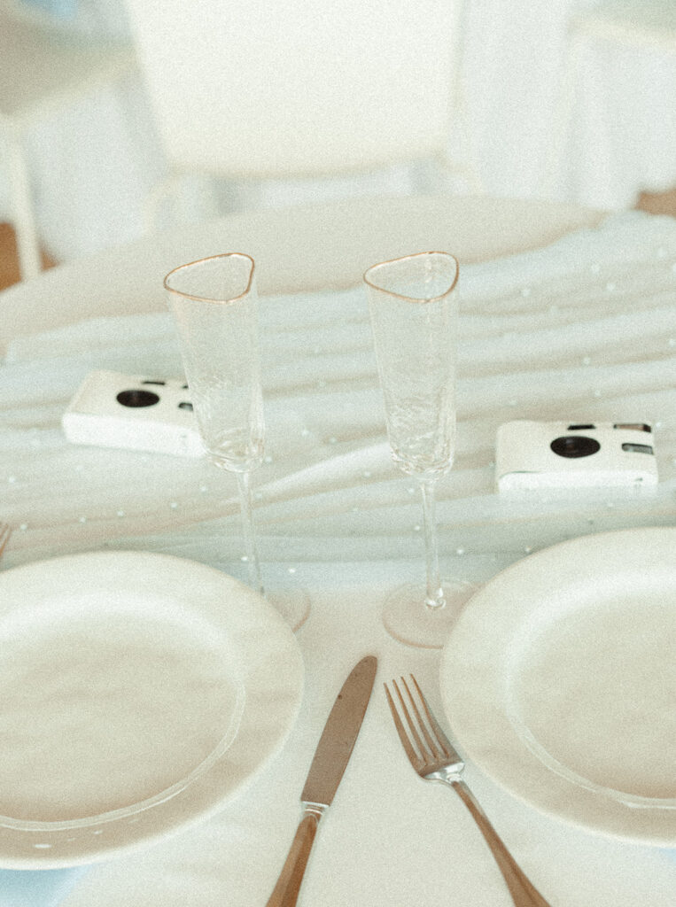 Wedding place settings on reception table at a Door County wedding