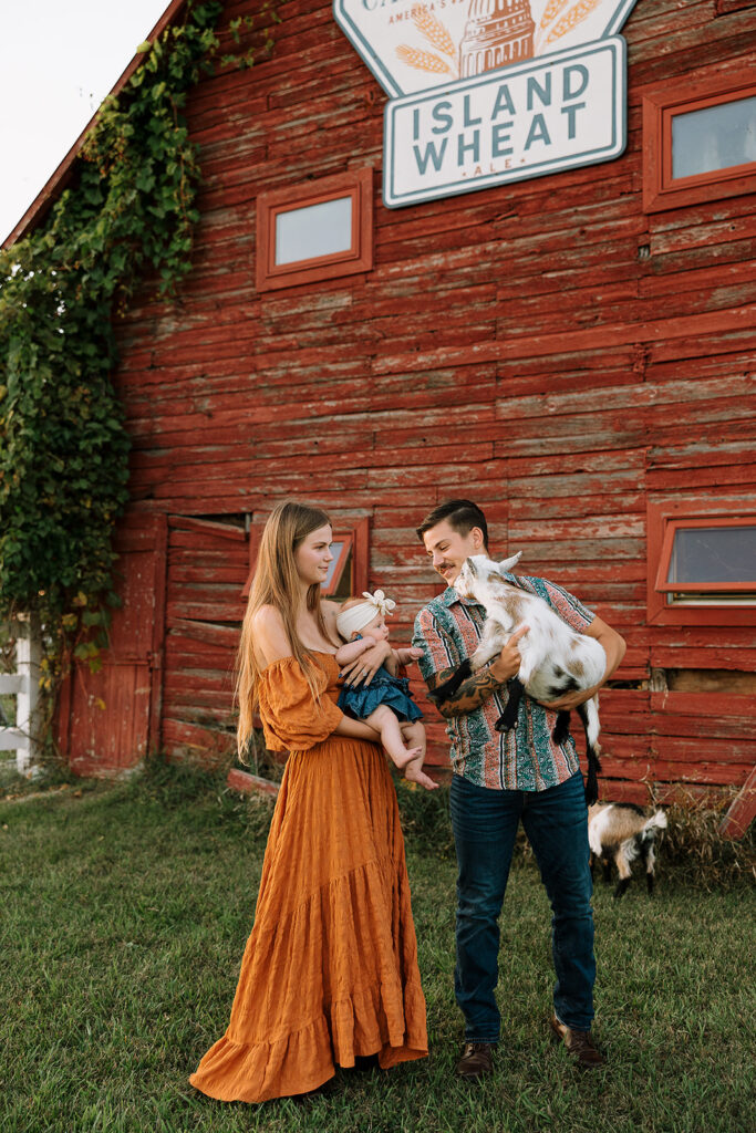 Natural family moment captured outdoors on a farm during a fall family photography session in Door County.